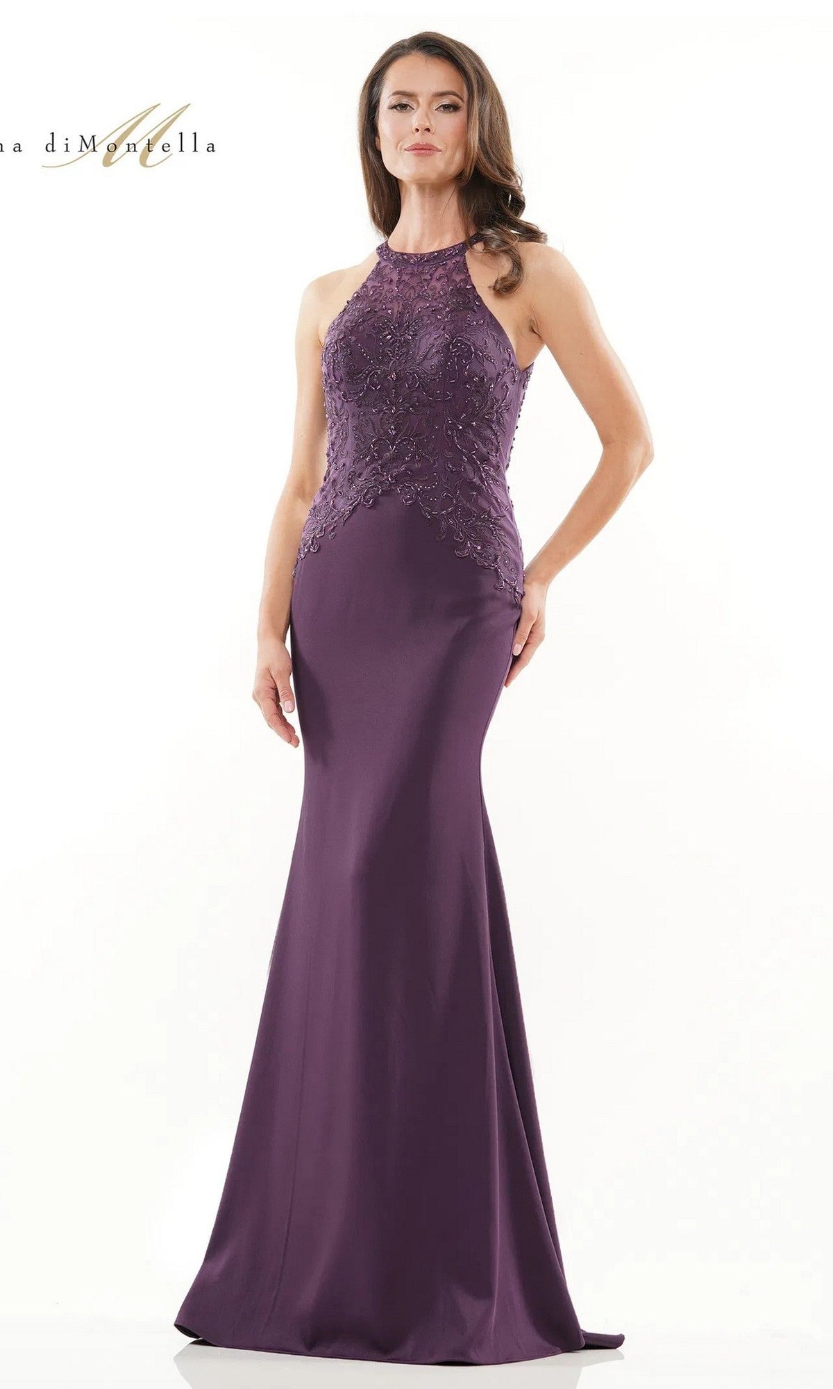 A woman in the Rina Di Montella RD2755 long formal dress, eggplant color, with a sleeveless embroidered lace bodice and floor-length skirt, stands against a plain white background.